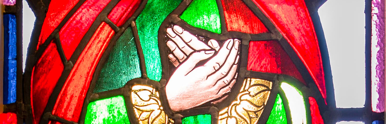 Stain glass of praying hands