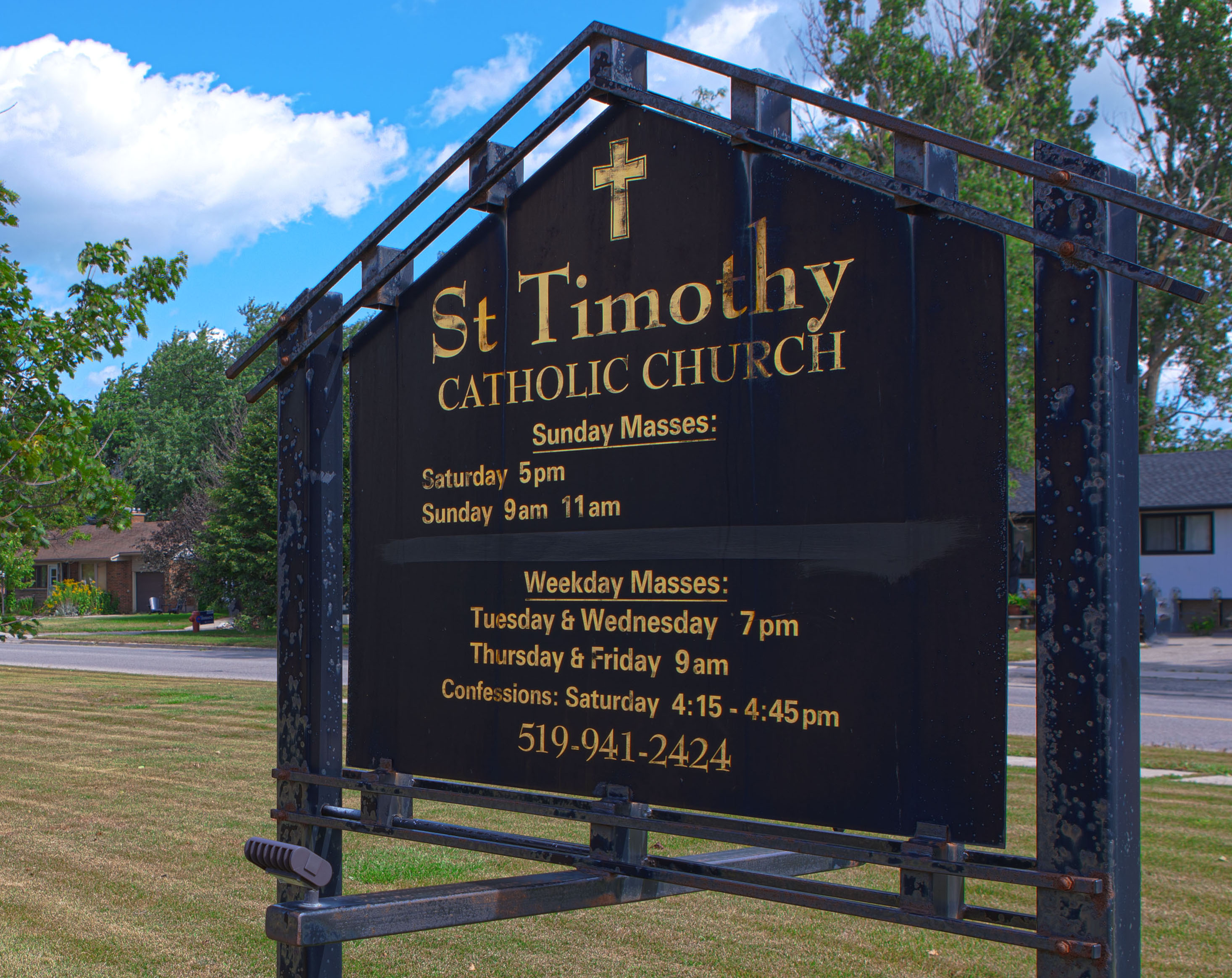 St. Timothy outdoor sign with Mass Schedule